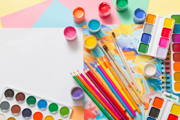 istock paints, pencils and brushes on paper 1162241760