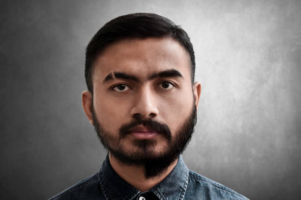 istock Portrait of man with half shaved beard 1162242753