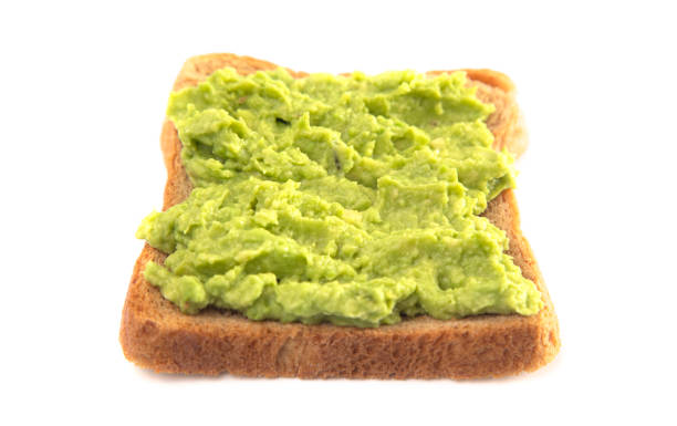istock Avocado Toast on Wheat Bread Isolated on a White Background 1162244431