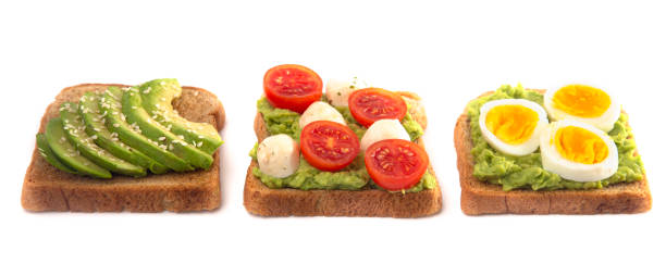istock Three Pieces of Avocado Toast with Toppings Isolated on a White Background 1162244620