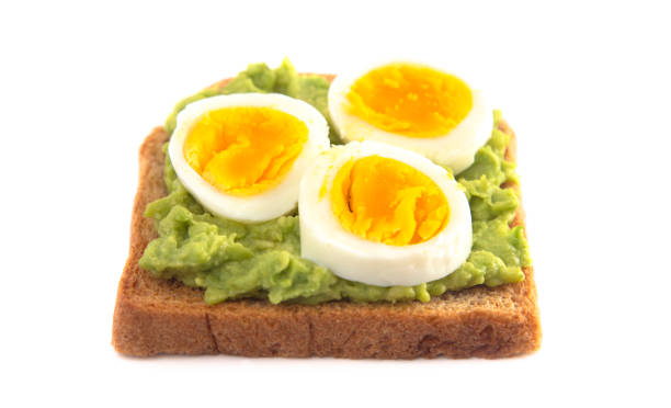 istock Boiled Egg Avocado Toast with Toppings Isolated on a White Background 1162244791
