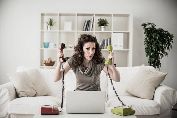 istock Working and having fun with a laptop and old fashioned analog telephones 1162245578