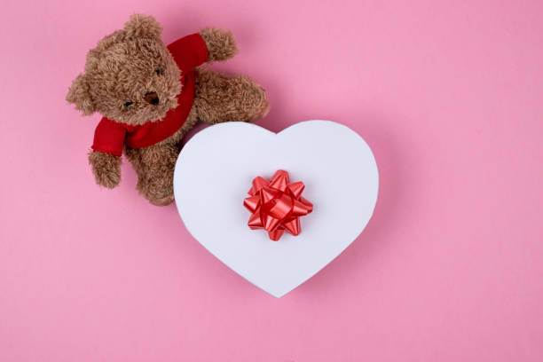 istock Teddy bear, white box hearts shaped with red bow, Valentines Day gift . Present for the christmas, thanks giving day, birthday holiday. 1162246276