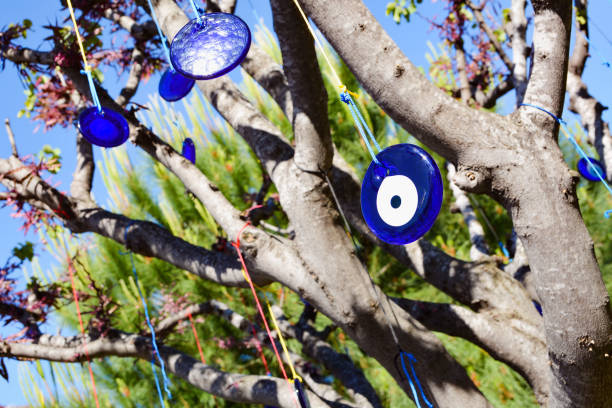 istock Amulet evil eye will protect from troubles and unhappiness hanging in the branches of trees. Turkey 1162250099