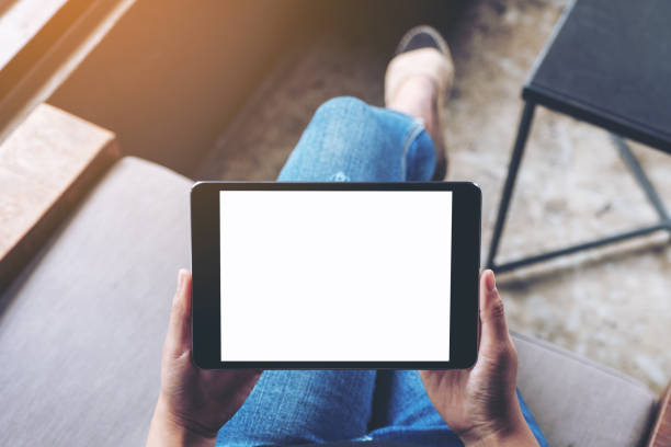 istock a woman holding black tablet pc with blank white screen 1162251633