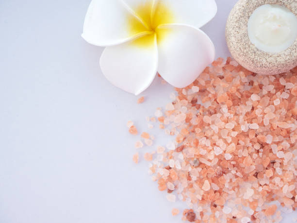 istock Pink salt in a spa set on white background / Himalayan salt 1162252419