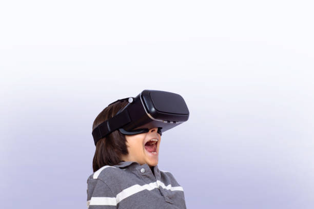 istock Little boy playing video games with VR. 1162252685