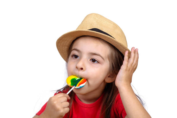istock Little girl eating a lollipop. 1162252720