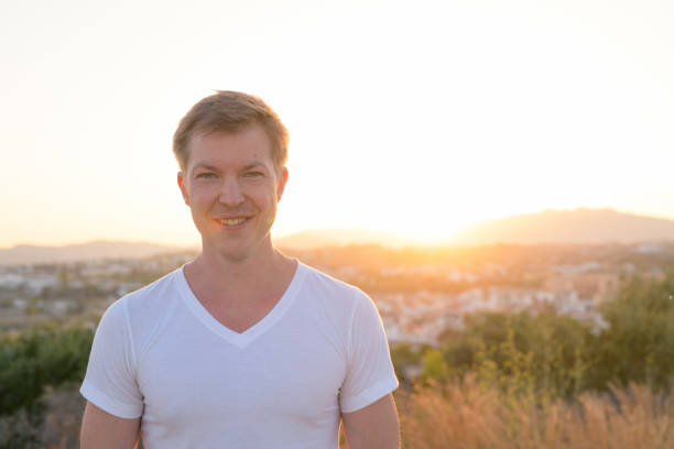 istock Young Handsome Tourist Man Smiling Against Sunlight 1162255879