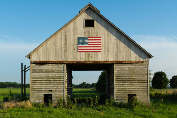 istock Old wooden barn with American Flag 1162255898