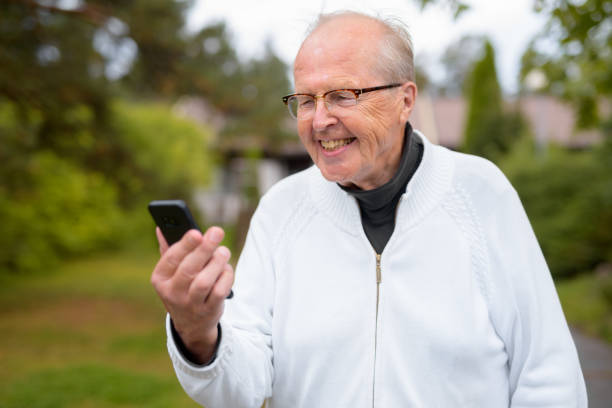 Portrait of senior man wearing eyeglasses at home outdoors