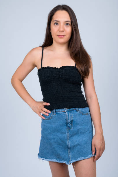istock Young beautiful multi-ethnic woman standing against white background 1162256043