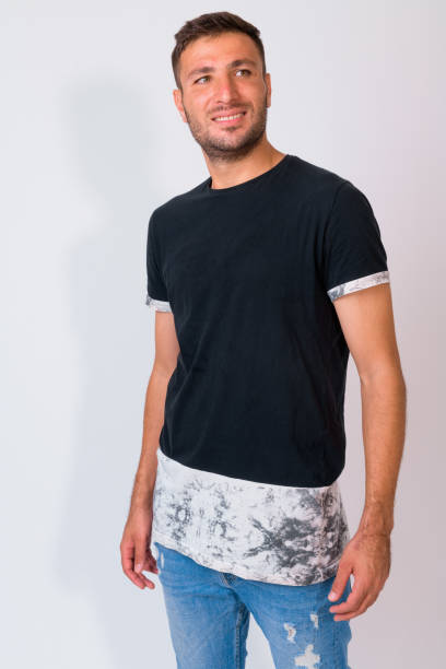 istock Happy bearded Persian man smiling while thinking against white background 1162256138