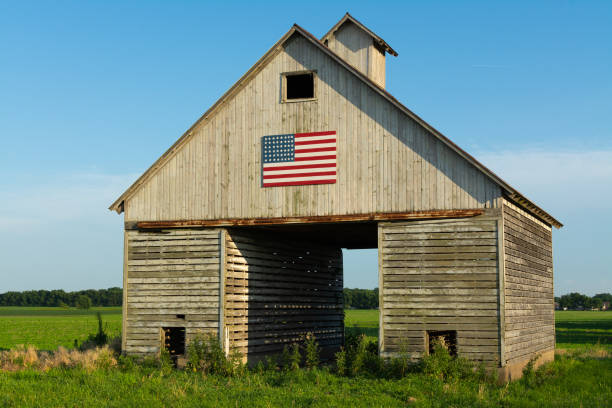 istock Old wooden barn with American Flag 1162256226