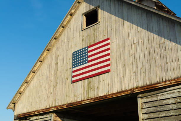 istock Old wooden barn with American Flag 1162256787