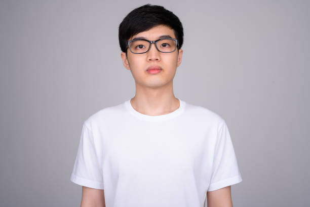 istock Studio shot of young Asian nerd man wearing eyeglasses 1162256793