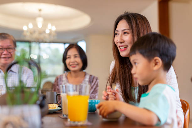 istock Young Asian Boy Enjoying Breakfast 1162256907