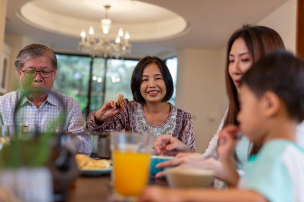istock Young Asian Boy Enjoying Breakfast 1162256971