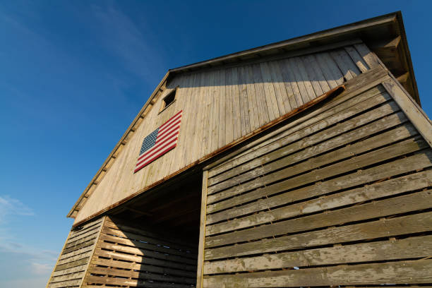 istock Old wooden barn with American Flag 1162257760
