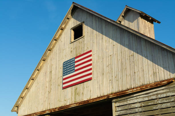 istock Old wooden barn with American Flag 1162257906