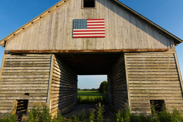 istock Old wooden barn with American Flag 1162257907