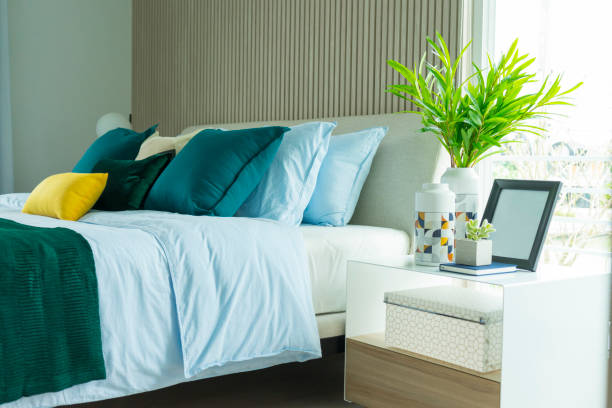 istock modern bedroom interior with green and yellow pillow on it. 1162260658