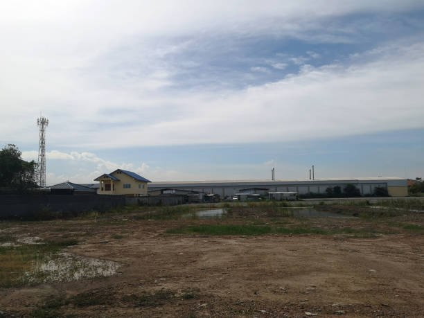 istock Land for sales concept. Landscape of empty land plot for development, and beautiful blue sky. 1162260663