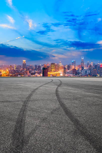 istock Empty race track and modern city skyline in Shanghai at sunset 1162261540