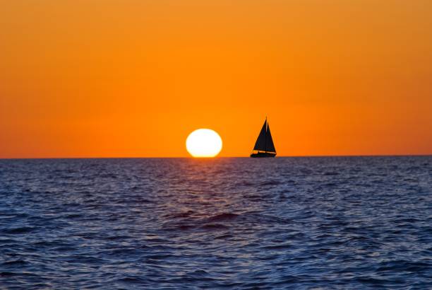 istock sail yacht silhouette in a evening sea 1162264179
