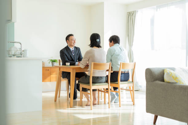 istock Businessman explaining to middle aged couple 1162265335