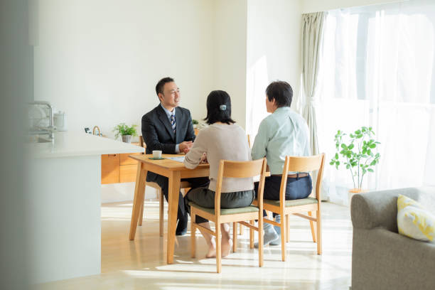 istock Businessman explaining to middle aged couple 1162265360
