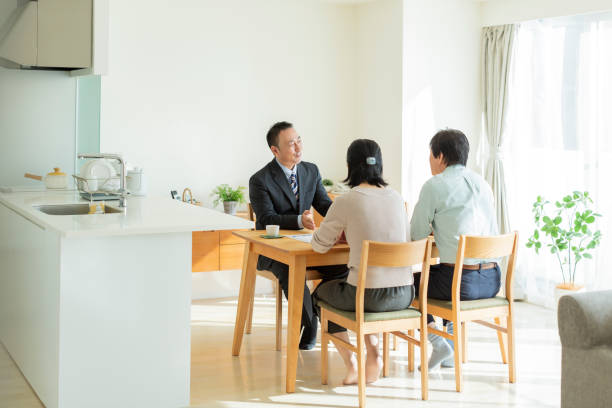 istock Businessman explaining to middle aged couple 1162265363
