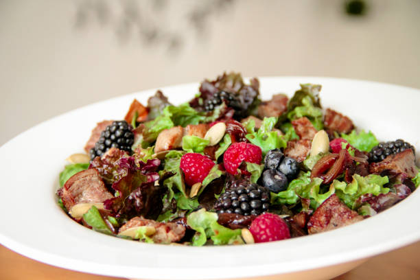 istock Salad bowl with grilled beef steak and berries 1162269332
