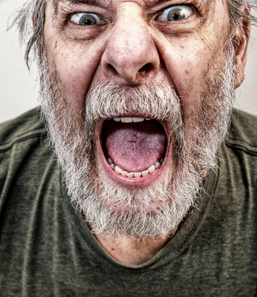 istock Distraught Close-Up Senior Man Shrieking in Anger 1162271754
