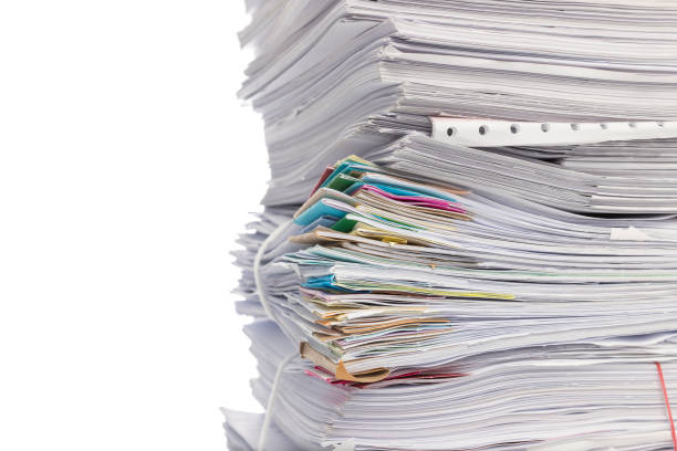 istock Stack of business papers isolated on white background 1162272436