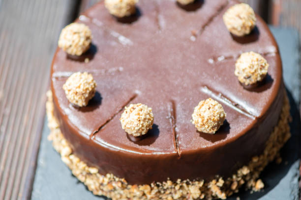 istock Chocolate cake on a wooden table with nuts 1162272524