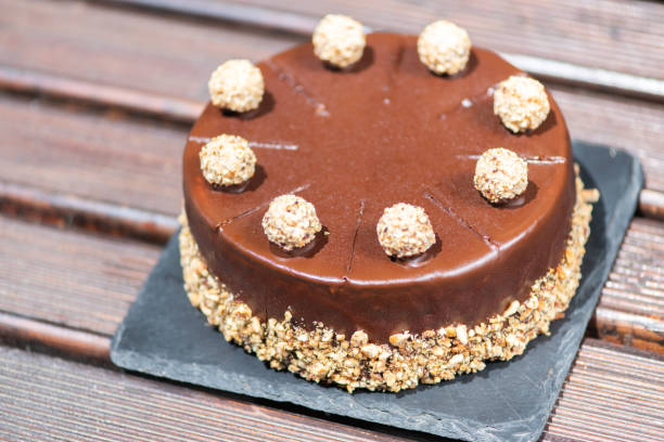 istock Chocolate cake on a wooden table with nuts 1162272528