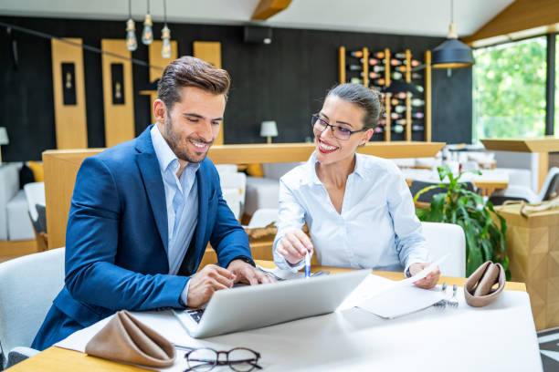 istock Coworkers discussing ideas in restaurant 1162273555
