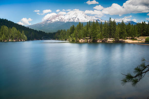 istock Clear water and mountain peak landscape 1162277735