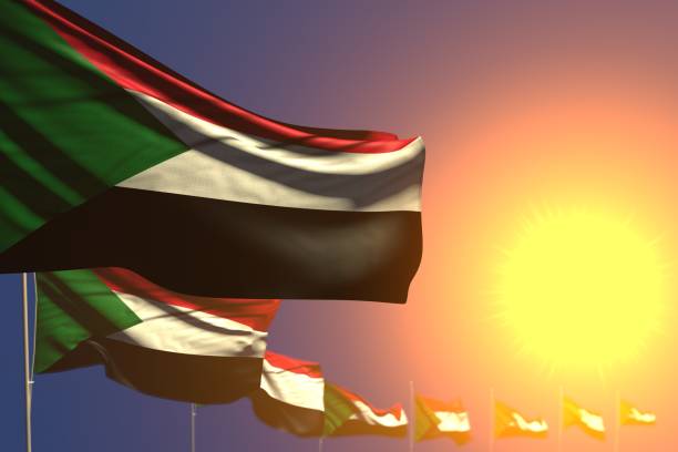istock wonderful many Sudan flags on sunset placed diagonal with bokeh and space for your content - any celebration flag 3d illustration 1162278750