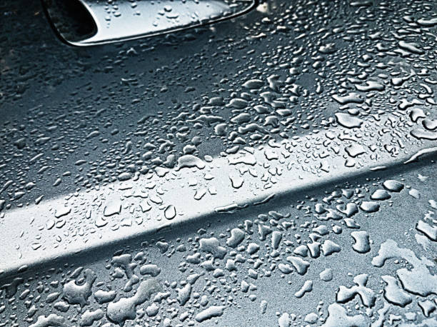 istock Raindrops on body of car 1162281944