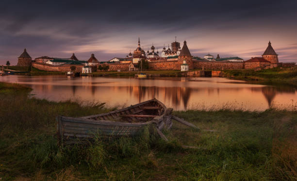 istock Solovki Or Solovetsky Islands,The Largest Archipelago Of White Sea. Classic View With Old Wooden Russian Boat On The Spaso-Preobrazhensky Solovetsky Monastery At High Tide And Windy Weather. Sight Of Russia 1162283336