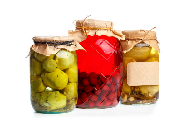 istock glass bottle with preserved food on black background - Image 1162284073