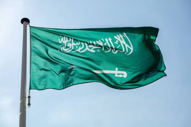 istock Saudi Arabian flag waving against clear blue sky 1162285845
