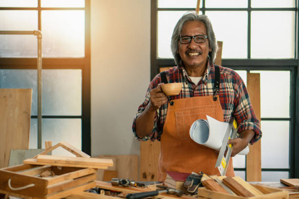 istock asian senior carpenter concentrating to his woodwork in workshop as hobby 1162285922