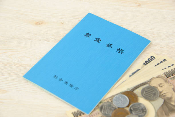istock Japanese pension handbook and currency 1162286696