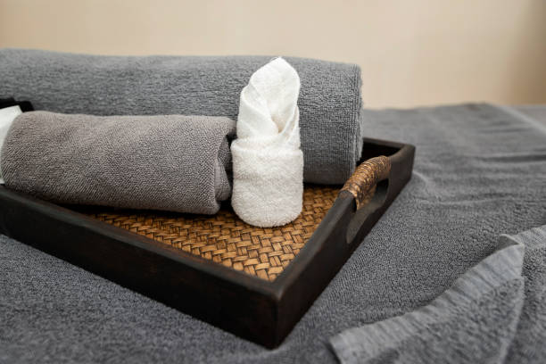 istock Towel in basket on massage table in modern spa salon 1162286795