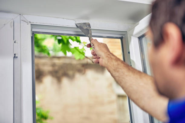 istock Worker using silicone for walls and widnows inside the house - renovation fixes. 1162286799