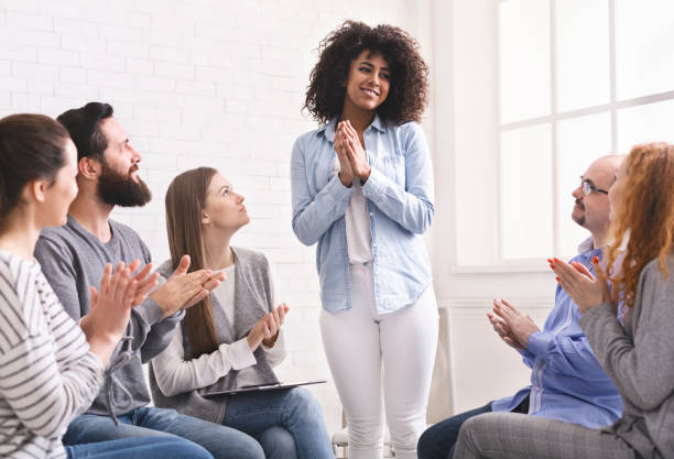 istock Grateful african woman sharing her progress with rehab group 1162289331