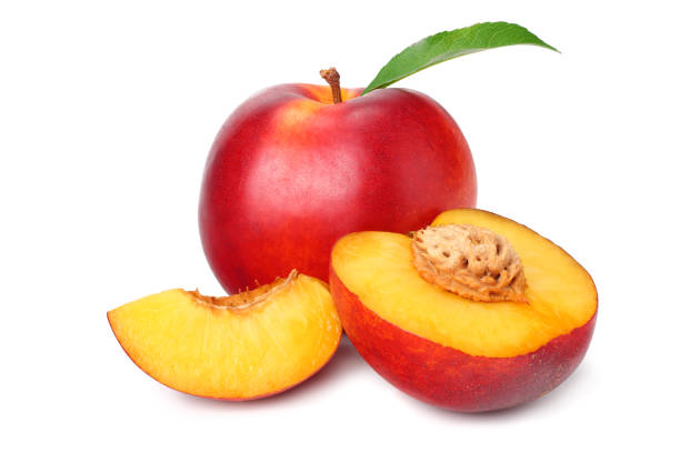 istock Nectarine with green leaf and slices isolated on white background 1162290144